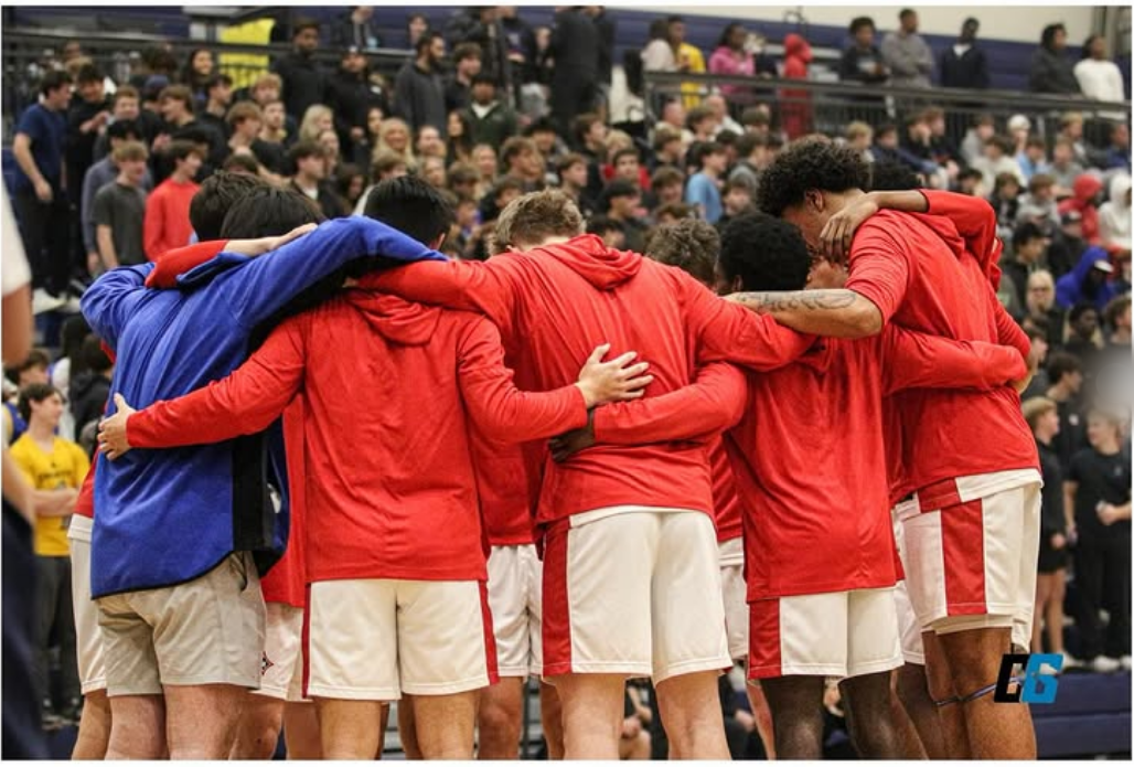 Walton Raiders basketball team huddle