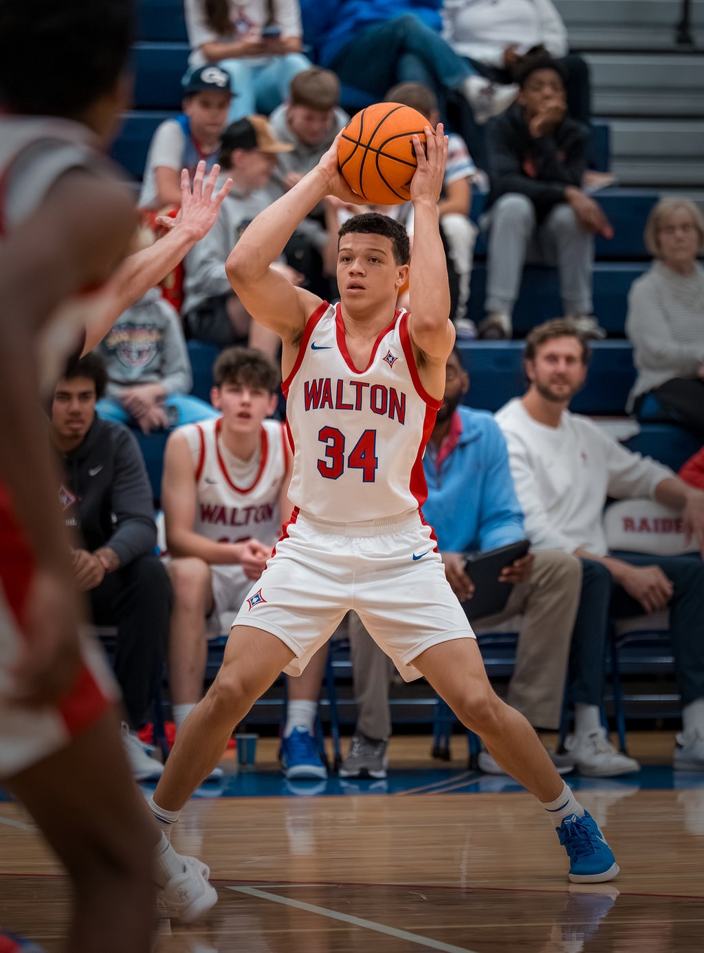 Walton Raiders boys basketball game action