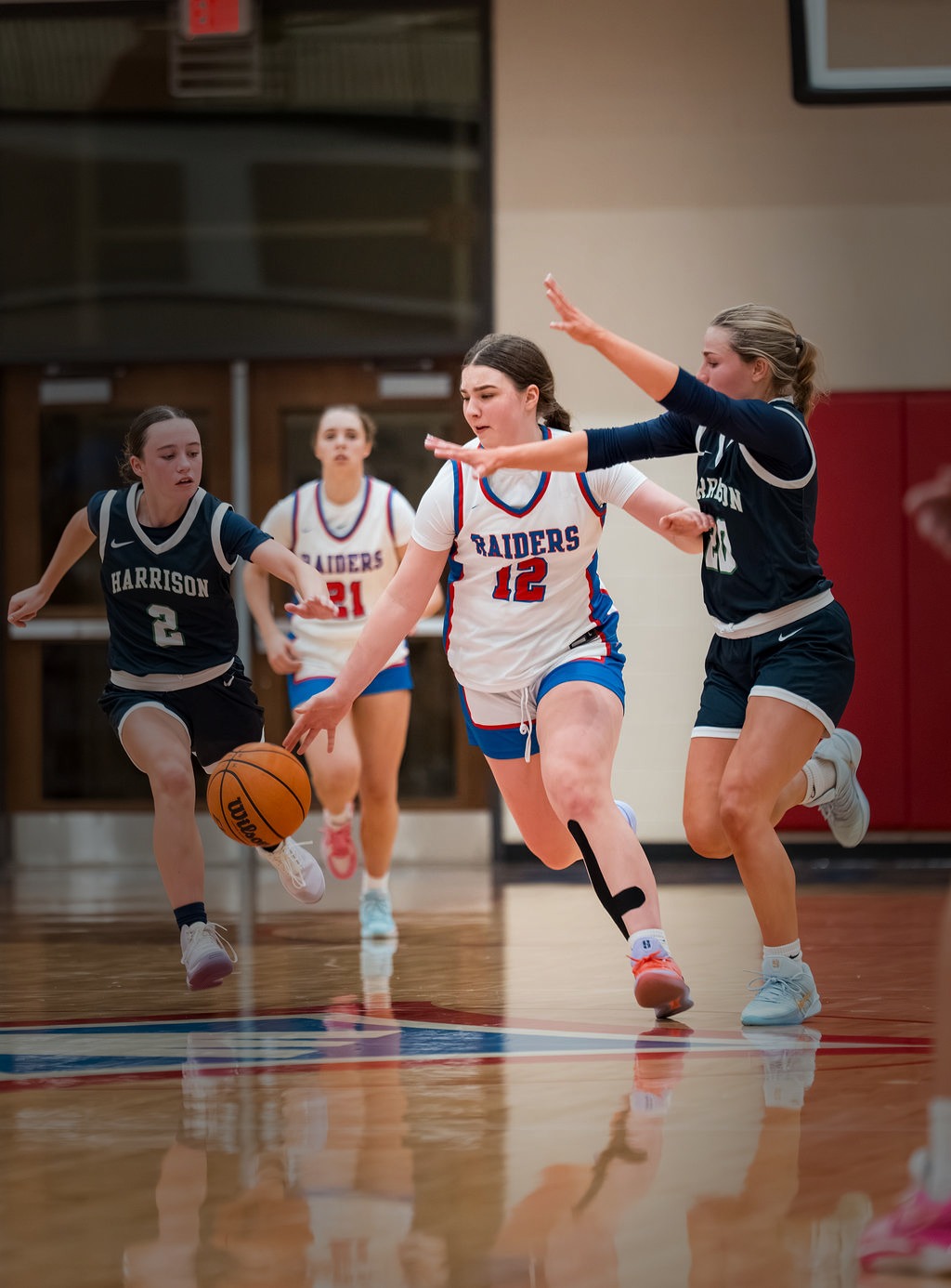 Walton Raiders girls basketball game action